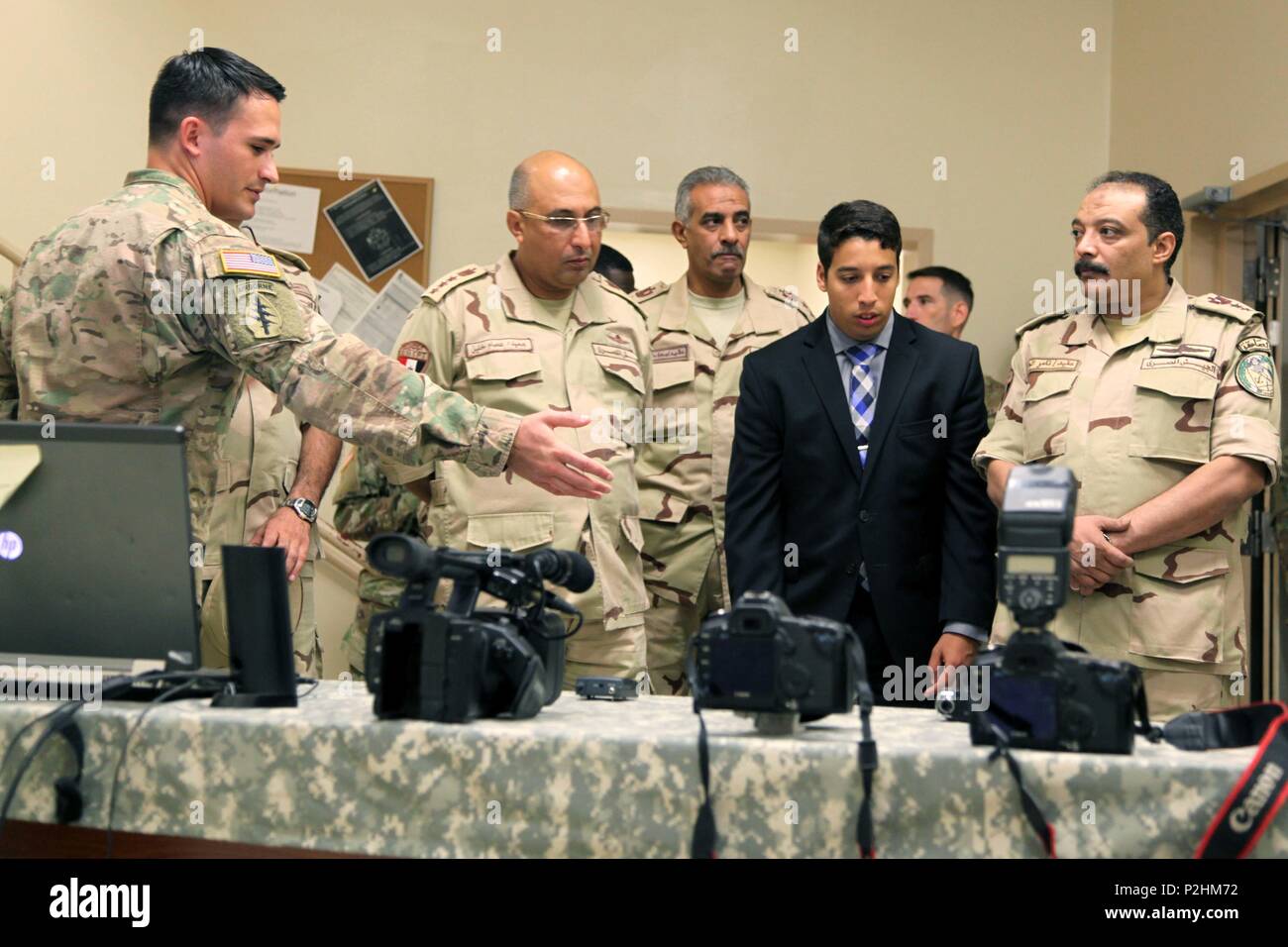A 4th Military Information Support Group Soldier briefs Brig. Gen. Khalil Essam Mohamed Elsayed (second from left), commander, Egyptian Human Development and Behavioral Sciences Center, on the equipment and capabilities of the Group’s audio/video teams during a visit to Fort Bragg, Sept. 24-28. Elsayed and three other Egyptian army officers traveled here to exchange information in order to coordinate training programs and synchronize efforts with U.S. partners. Stock Photo