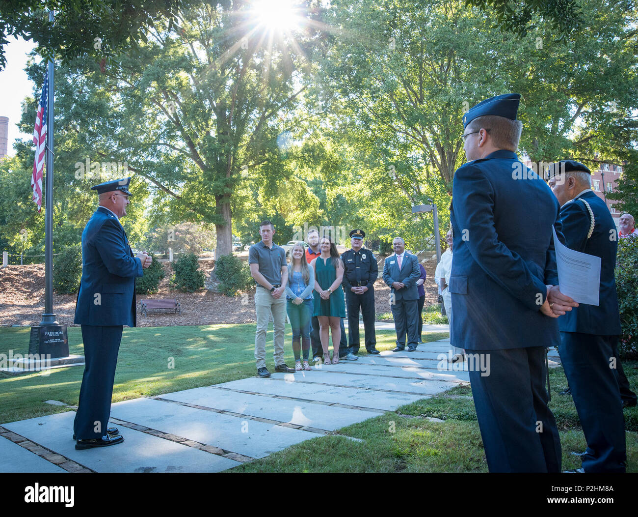 U.S. Air Force Lt. Col. Michael E. Mac Lain speaks to family and friends after his promotion ceremony at the Scroll of Honor in Clemson University’s Memorial Park, Sept. 30, 2016. Mac Lain is the Aeromedical Operations Flight Commander for the 43rd  Aeromedical Evacuation Squadron, Pope Army Airfield, Fort Bragg, NC. He directs daily flight operations for 60 assigned personnel, and provides medical care as a Flight Nurse on aeromedical evacuation missions. Mac Lain has deployed nine times to combat zones and successfully aero medically evacuated over 700 of the most ill and severely injured Am Stock Photo