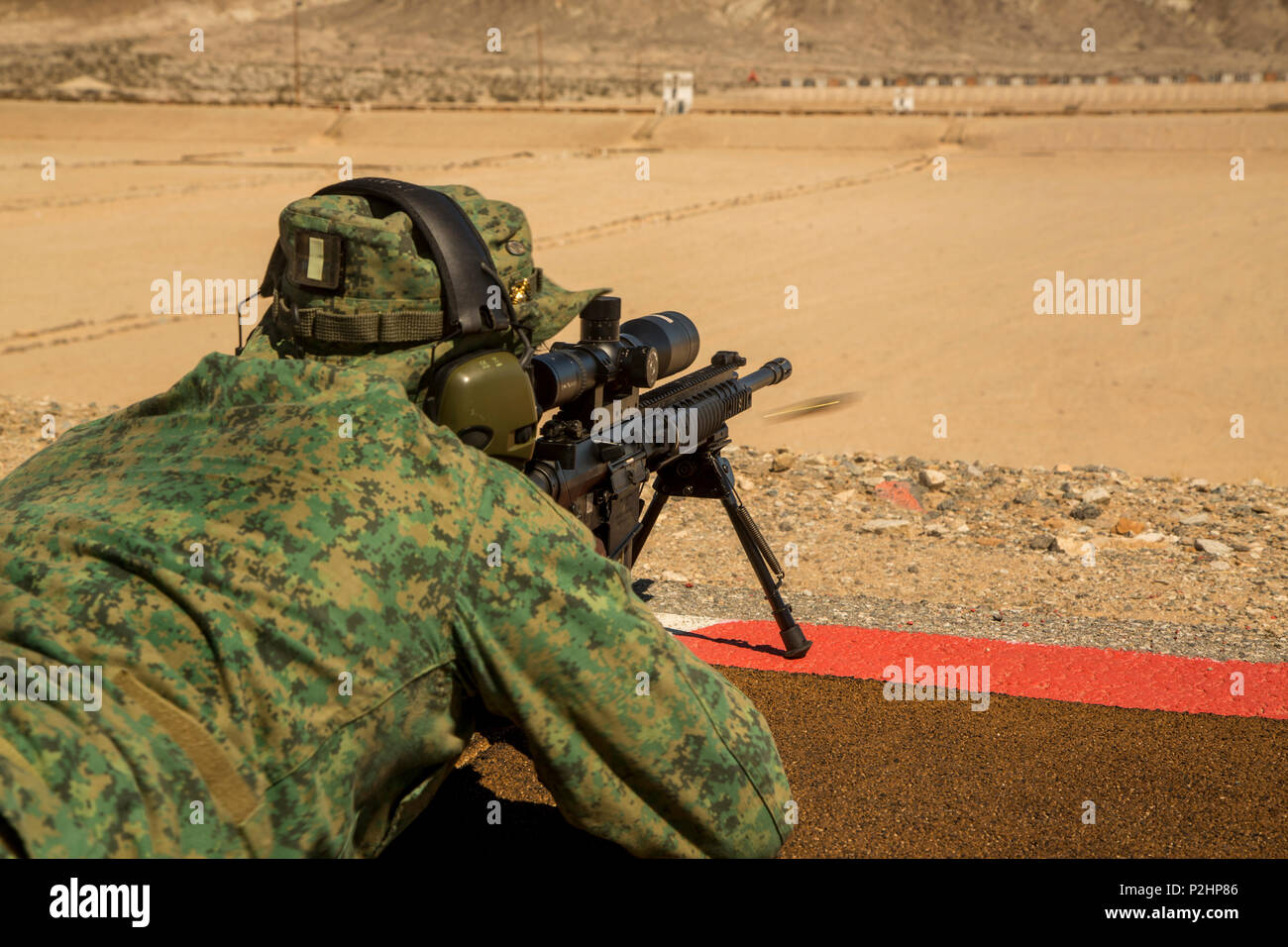 Known Distance Range A Singapore Armed Forces sniper participates in known distance rifle ...