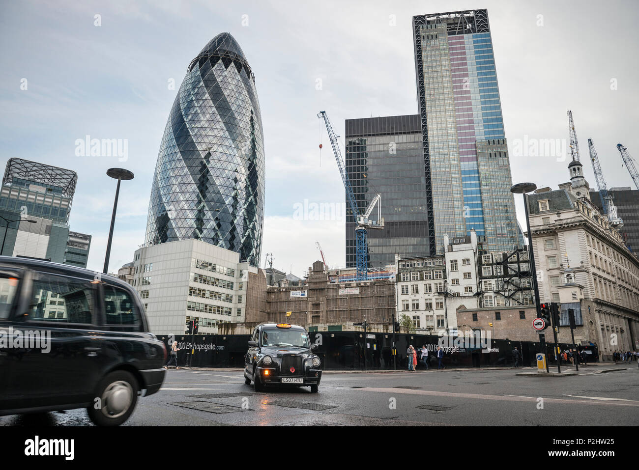 the Gherkin' by Norman Foster with typical London cab, Liverpool Street, City of London, England, United Kingdom, Europe Stock Photo
