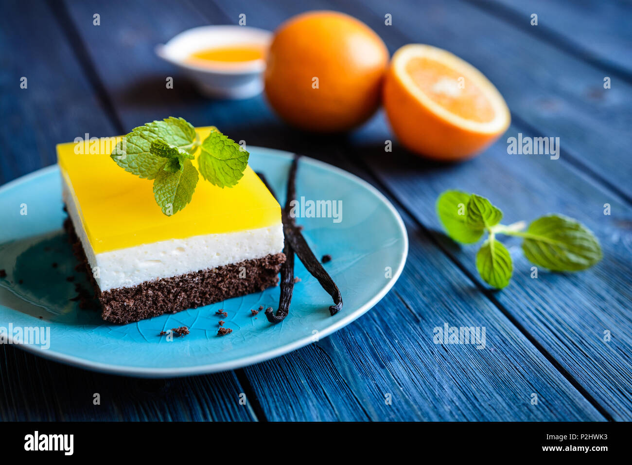 Delicious chocolate cake bars with mascarpone layer and orange jelly