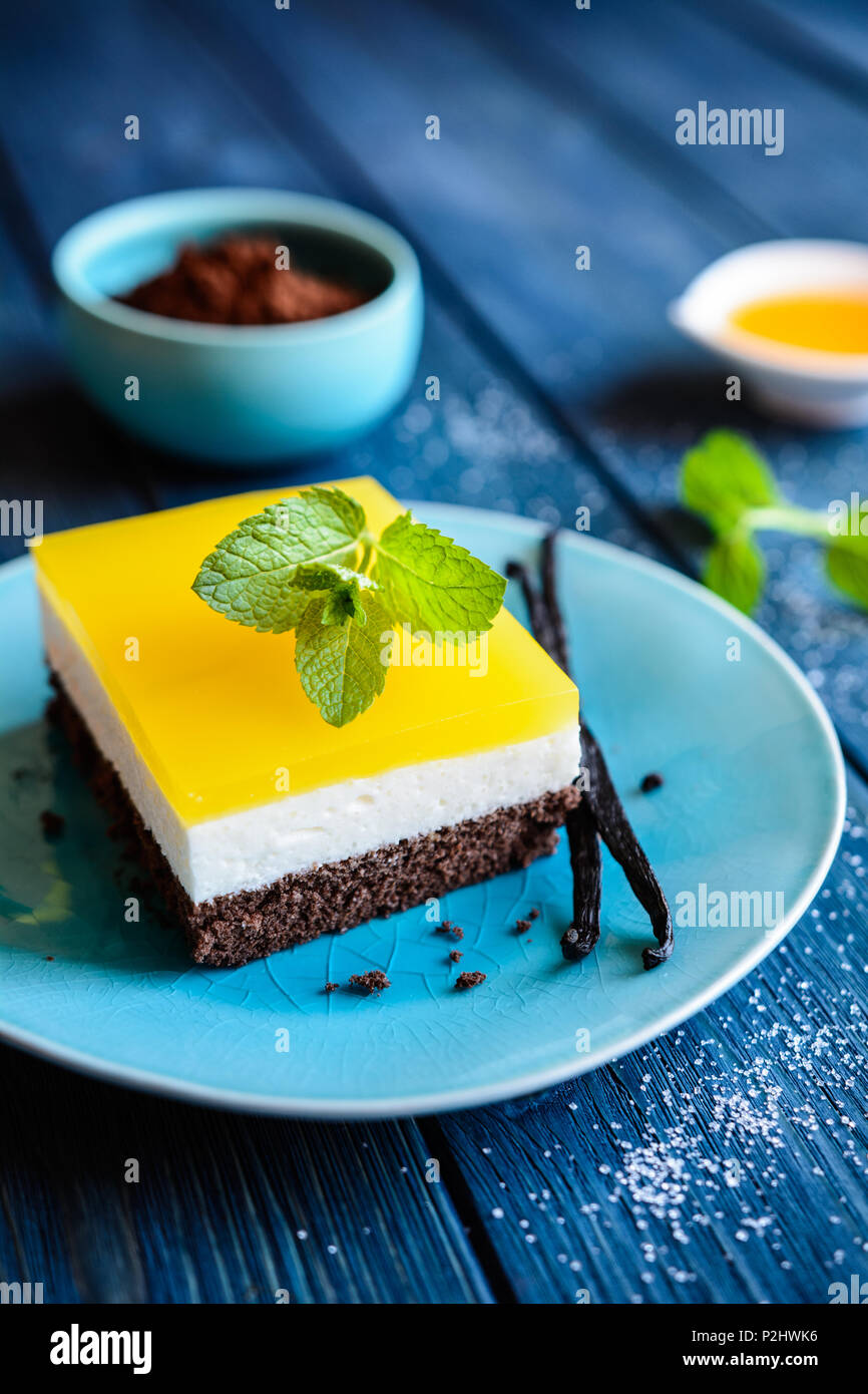 Delicious chocolate cake bars with mascarpone layer and orange jelly