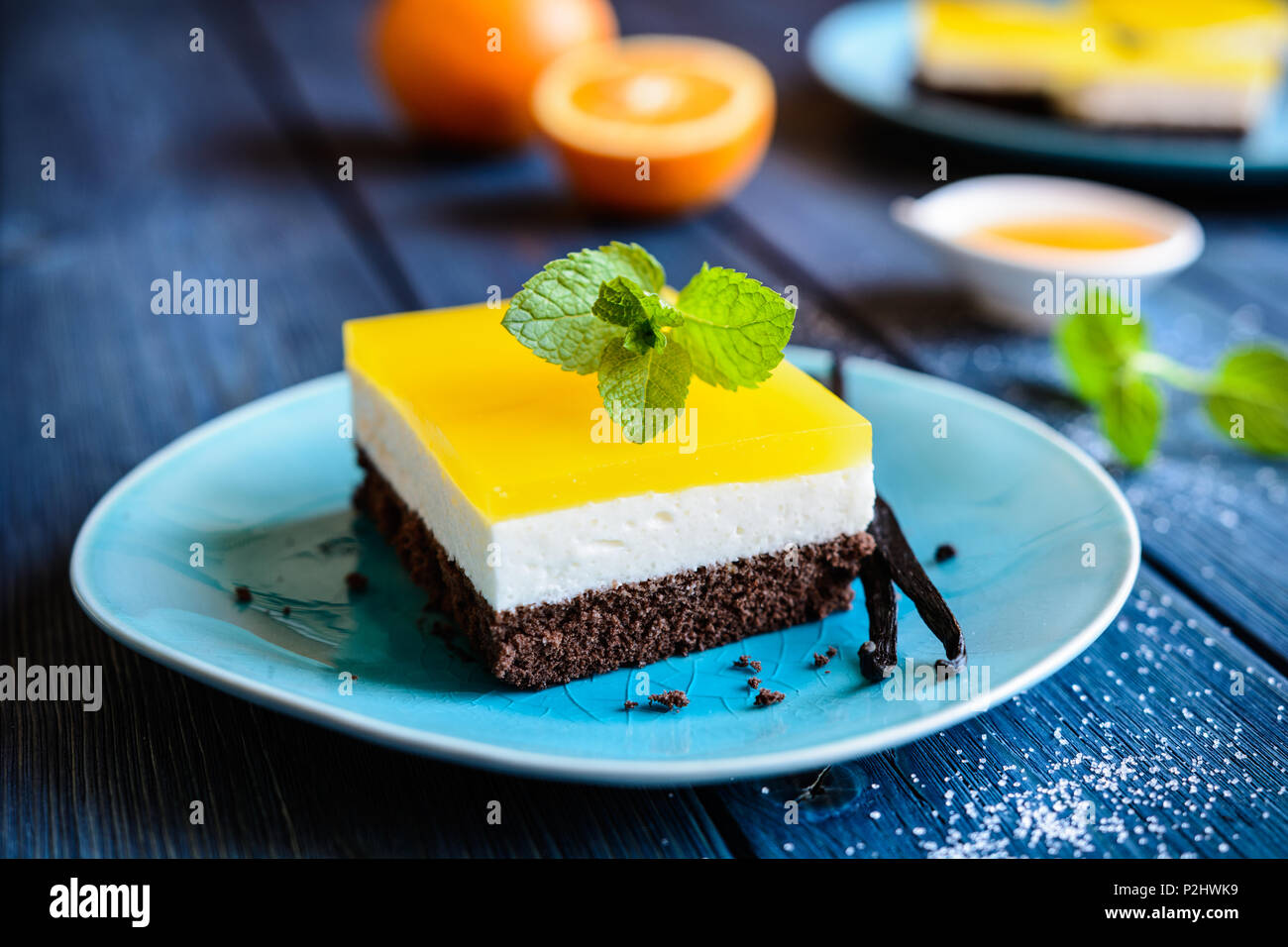 Delicious chocolate cake bars with mascarpone layer and orange jelly