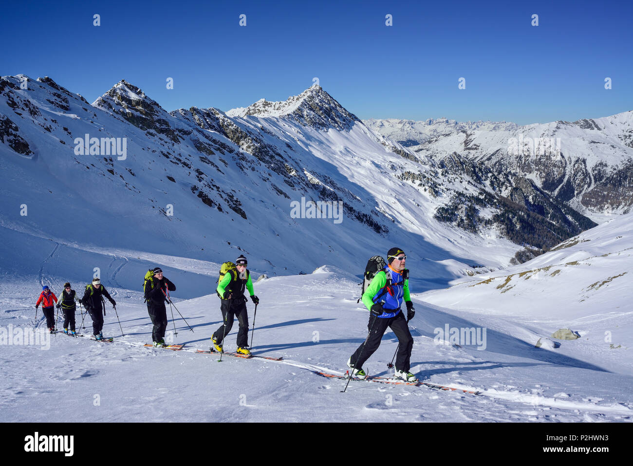 Several persons back-country skiing ascending towards Kleiner Kaserer, Hohe Warte in the background, Kleiner Kaserer, valley of Stock Photo