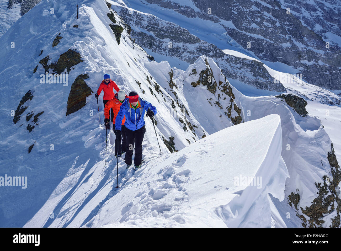 Three persons ascending on ridge towards Kleiner Kaserer, Kleiner Kaserer, valley of Schmirn, Zillertal Alps, Tyrol, Austria Stock Photo