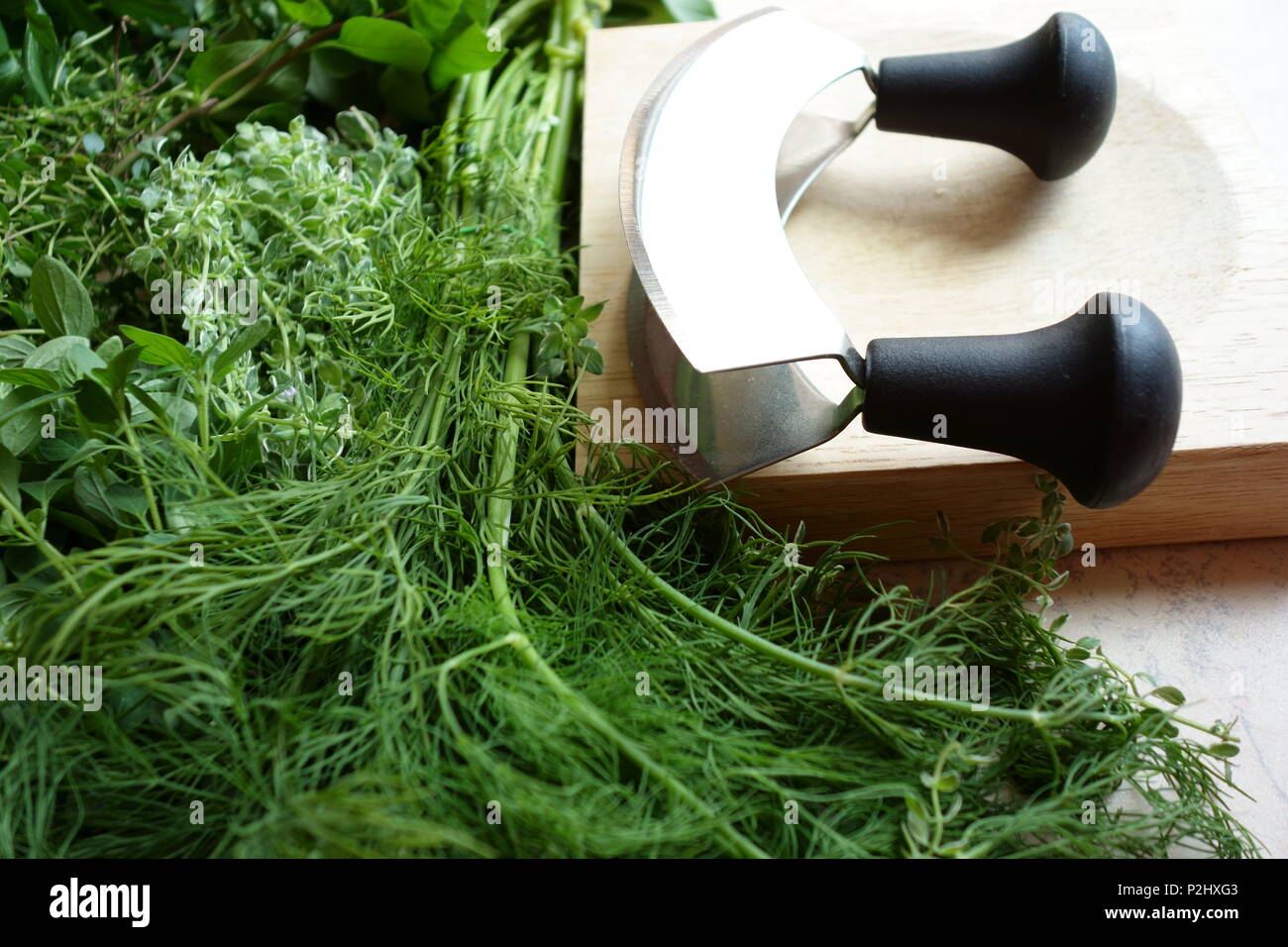Fresh herbs and chopping utensils Stock Photo Alamy