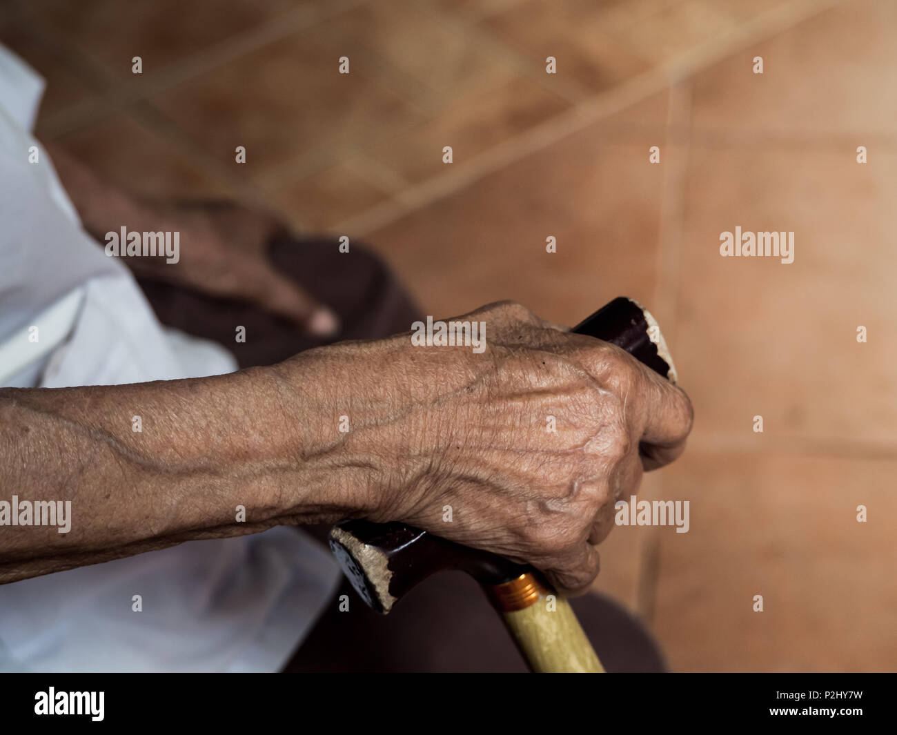 Old Thin Woman Right Hand Holding on Walking Cane Stock Photo