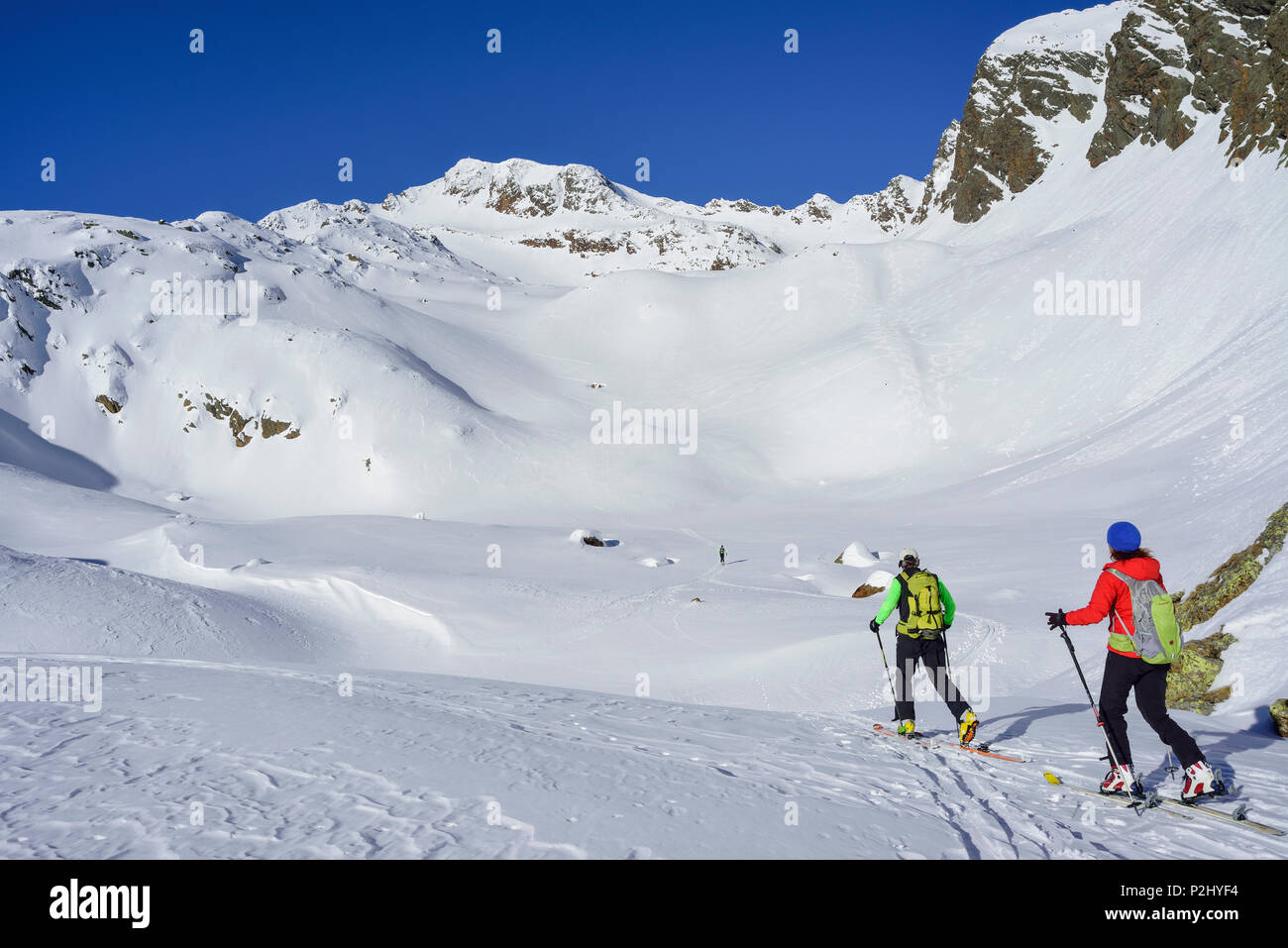 Two persons back-country skiing ascending towards Schneespitze, Schneespitze, valley of Pflersch, Stubai Alps, South Tyrol, Ital Stock Photo