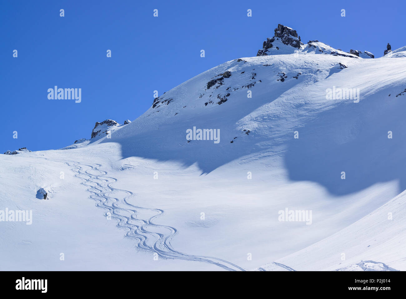 Downhill tracks in Valle di Stroppia, Valle Maira, Cottian Alps, Piedmont, Italy Stock Photo