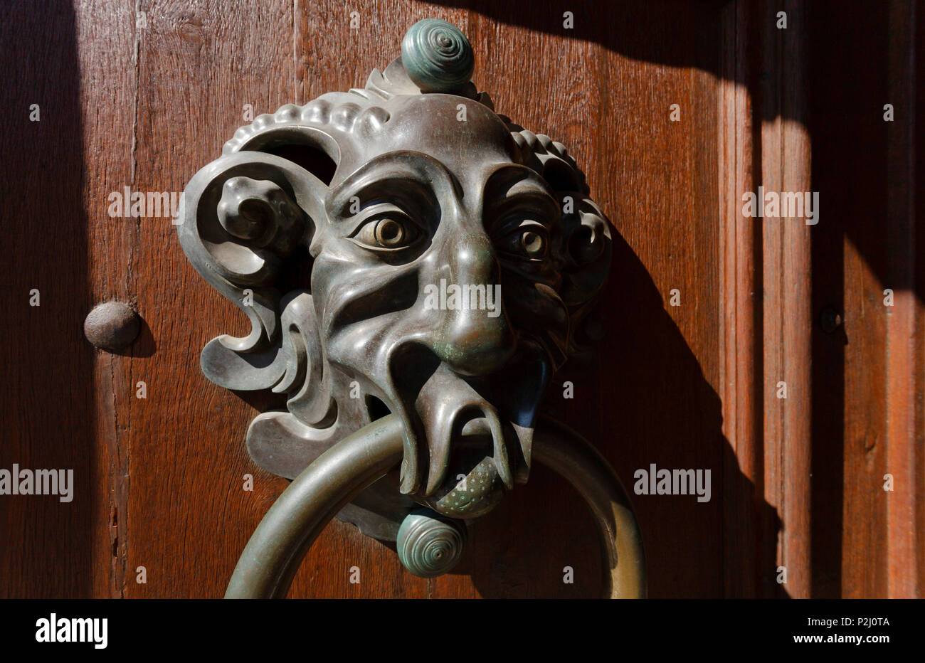 Door knocker at the entrance to the residence, New Residence of the Prince-Bishops of Bamberg, 17th century, historic city cente Stock Photo