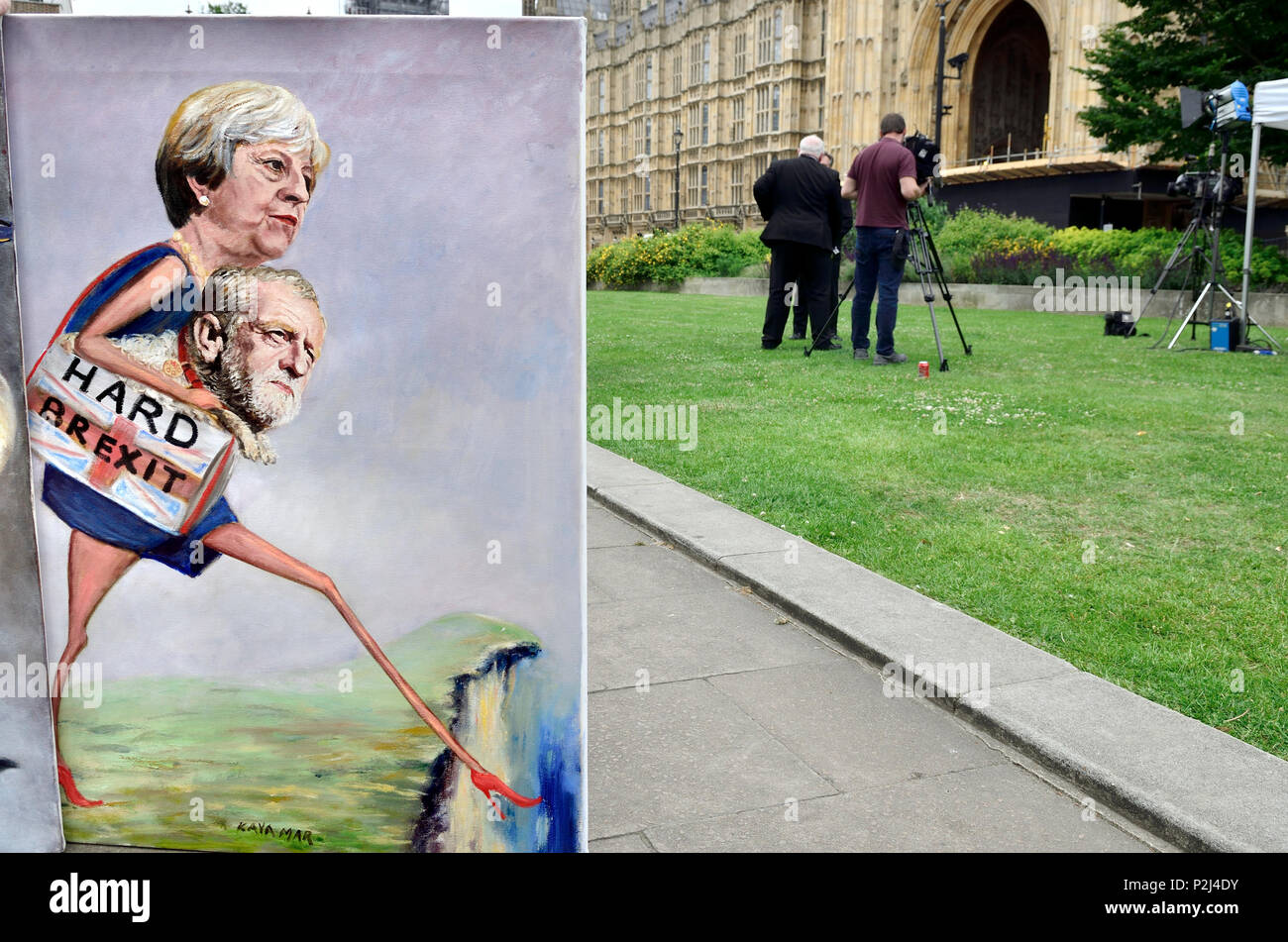 Kaya Mar - political cartoonist - with one of his Brexit paintings in Westminster - Theresa May, and Jeremy Corbyn - in Westminster, June 13th 2018 Stock Photo