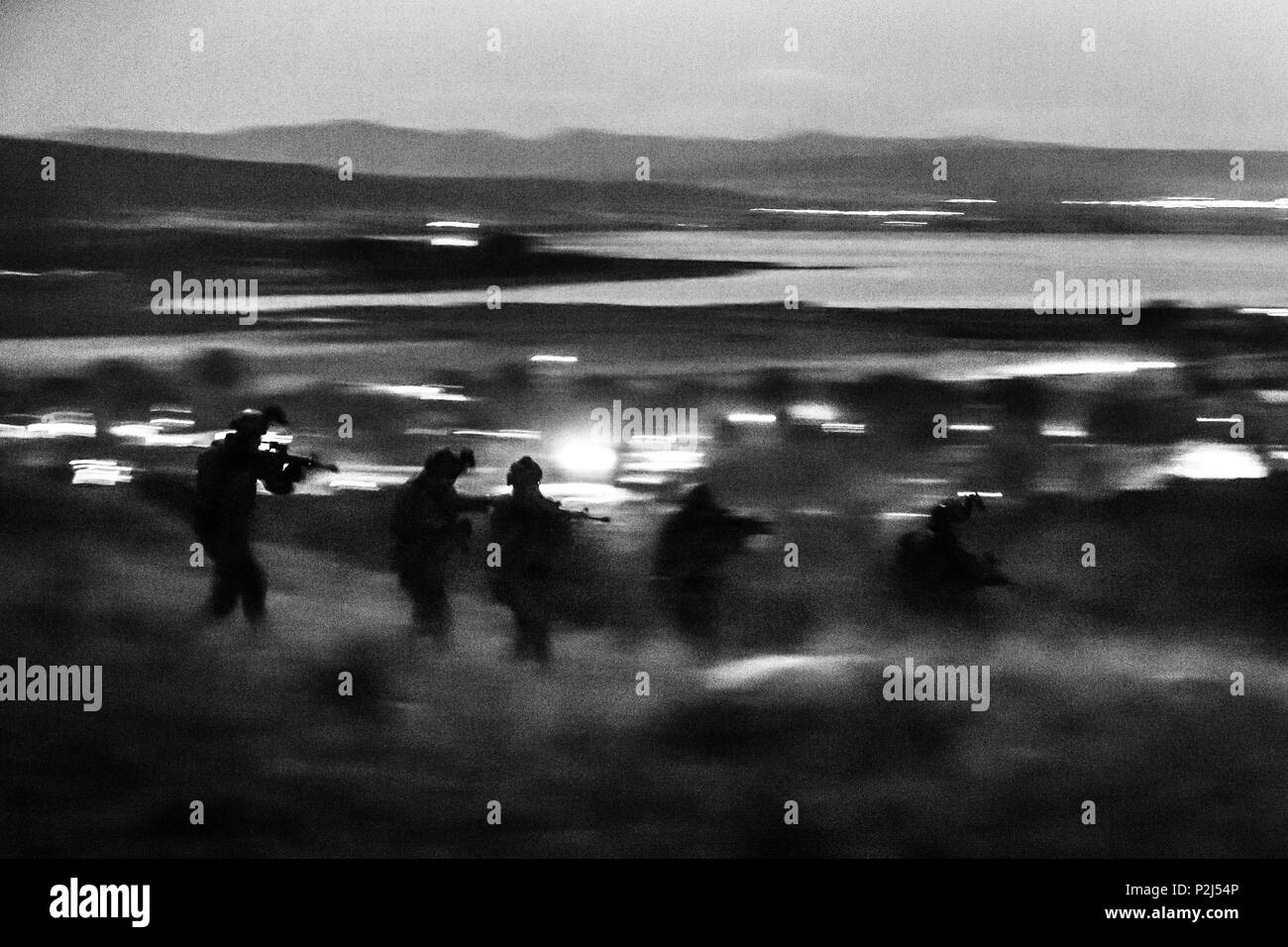 Greek special forces and U.S. Navy Seals attack an objective under the cover of night during Sarisa 16, an annual Greek exercise, near Thessaloniki, Greece, Sept. 20, 2016. (U.S. Army photo by Staff Sgt. Marcus Fichtl) Stock Photo