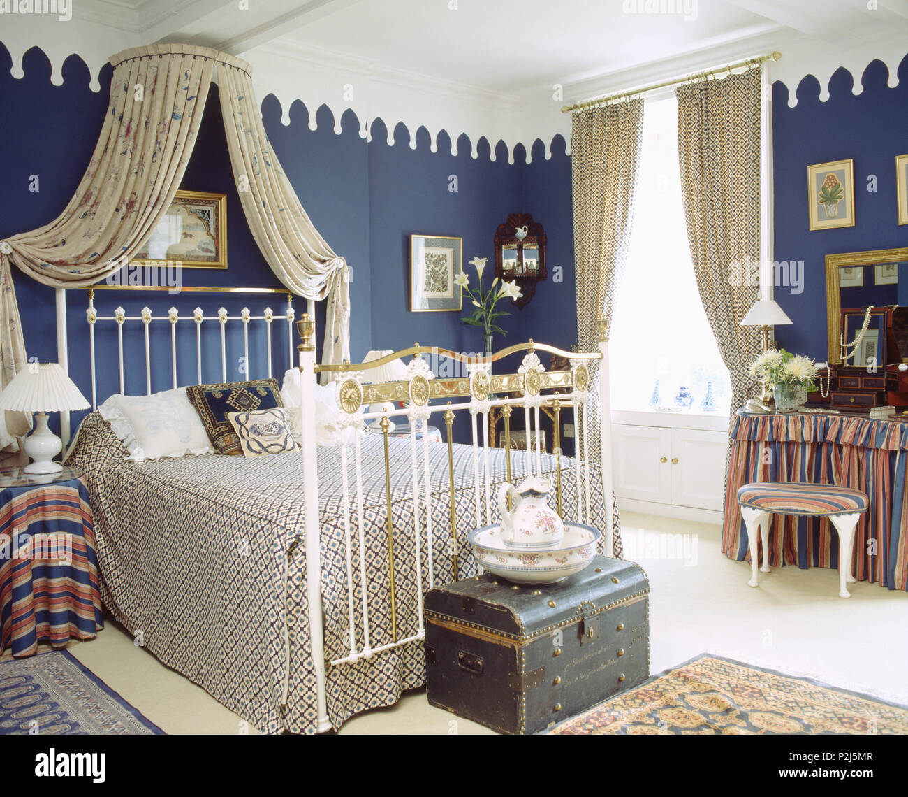 Gothic Style Cornice In Blue Bedroom With White Ceiling And