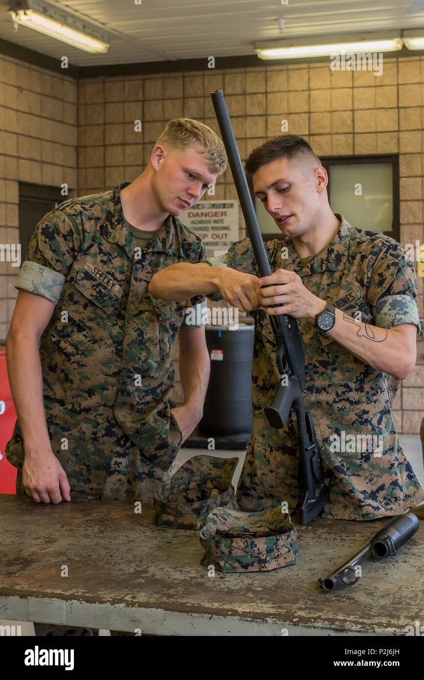 Lance Cpl. Charles Duncan shows Marines how to assemble the Benelli