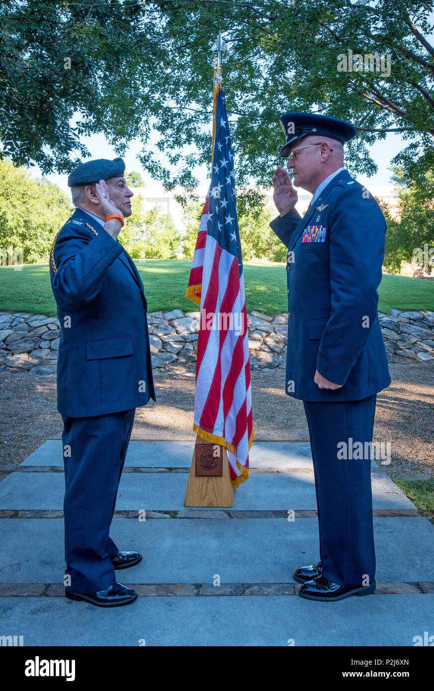 Retired U.S. Air Force Col. Sandy Edge gives the Oath of Office to Lt. Col. Michael E. Mac Lain - son of Clemson Tigers football players Sean and Eric - during Mac Lain’s promotion ceremony at the Scroll of Honor in Clemson University’s Memorial Park, Sept. 30, 2016. Mac Lain is the Aeromedical Operations Flight Commander for the 43rd  Aeromedical Evacuation Squadron, Pope Army Airfield, Fort Bragg, NC. He directs daily flight operations for 60 assigned personnel, and provides medical care as a Flight Nurse on aeromedical evacuation missions. Mac Lain has deployed nine times to combat zones an Stock Photo
