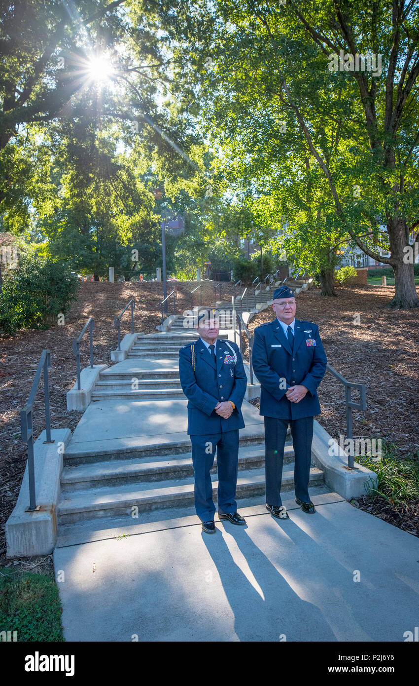 The path to promotion: Retired U.S. Air Force Col. Sandy Edge and Maj. Michael E. Mac Lain wait to enter a ceremony promoting Mac Lain to lieutenant colonel at the Scroll of Honor in Clemson University’s Memorial Park, Sept. 30, 2016. Mac Lain is the Aeromedical Operations Flight Commander for the 43rd  Aeromedical Evacuation Squadron, Pope Army Airfield, Fort Bragg, NC. He directs daily flight operations for 60 assigned personnel, and provides medical care as a Flight Nurse on aeromedical evacuation missions. Mac Lain has deployed nine times to combat zones and successfully aero medically eva Stock Photo