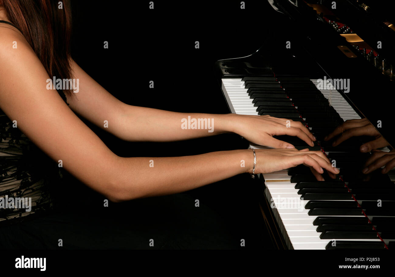 Generic - female pianists hands on the keys Stock Photo