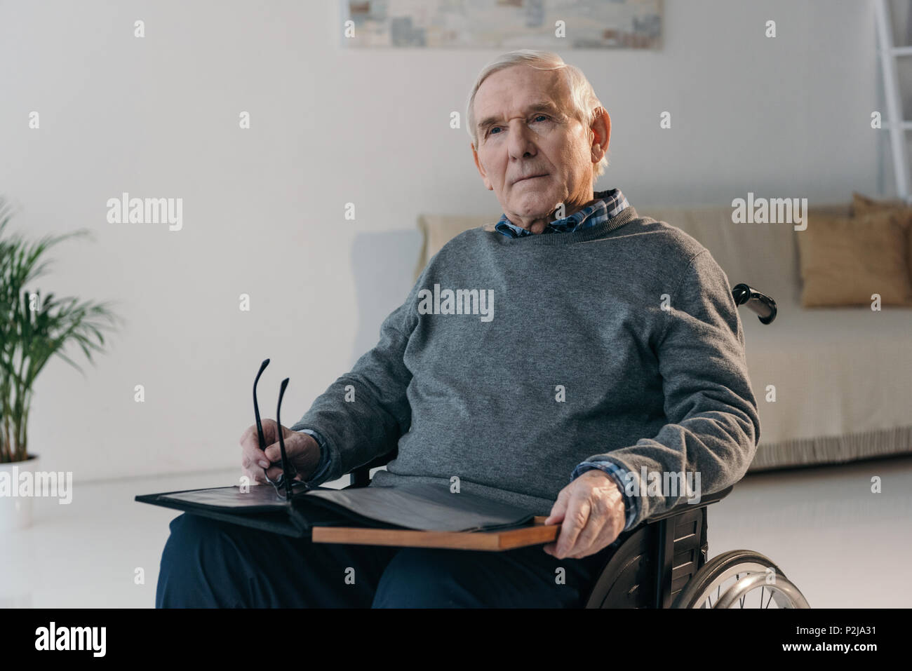Old man wheelchair sad hi-res stock photography and images - Alamy