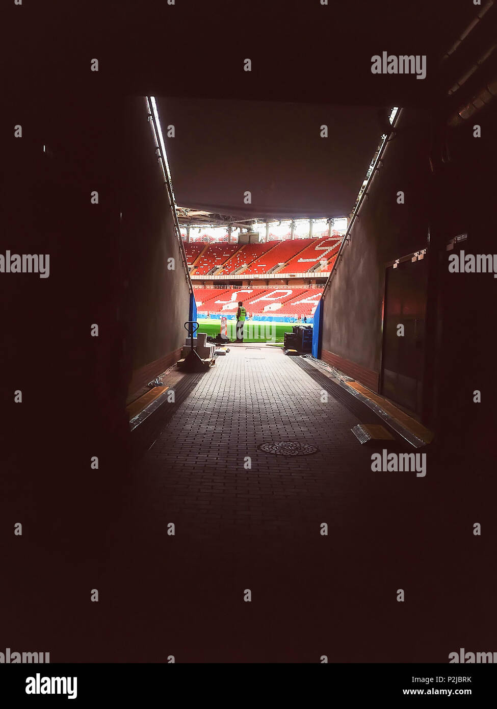 MOSCOW, RUSSIA - JUNE, 13, 2018: Otkritie Arena, Spartak football club stadium, 2018 FIFA World Cup. Arena tunnel. Player entrance on empty stadium with playing field Stock Photo