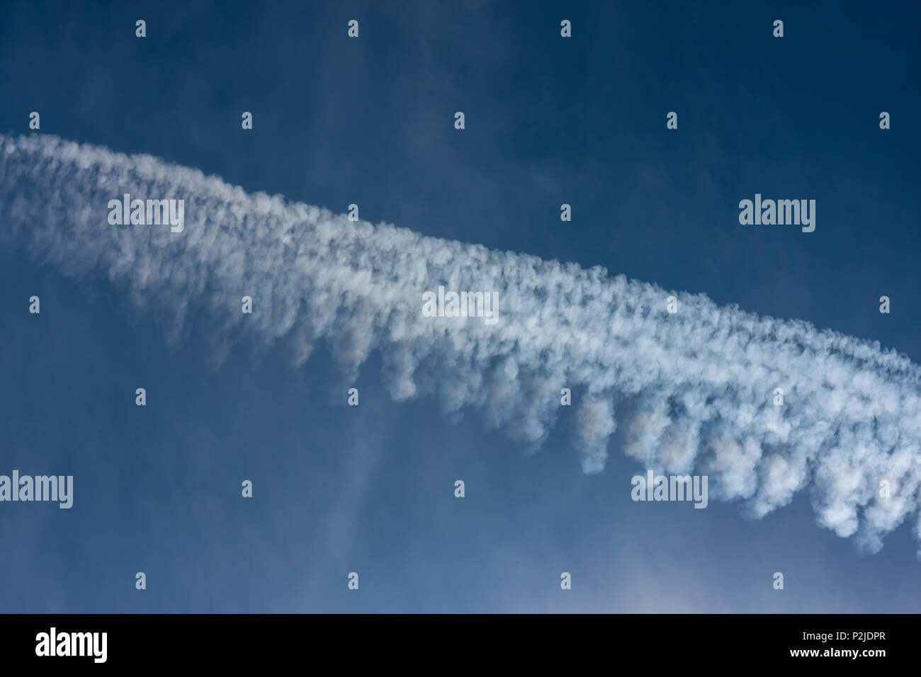 Environmental pollution by airplanes - chemtrails or contrails Stock Photo