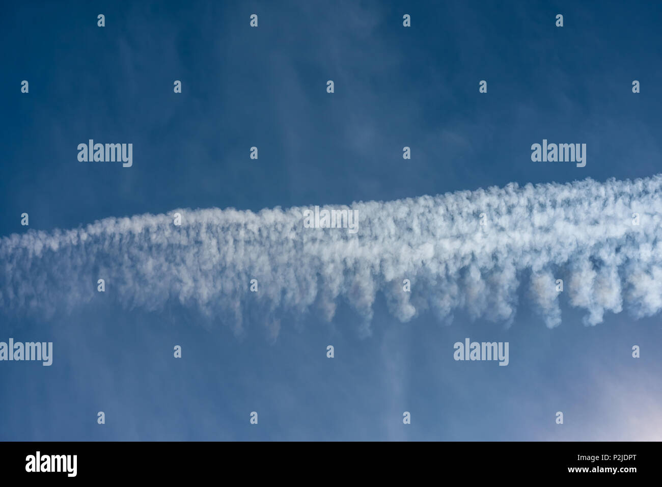 Environmental pollution by airplanes - chemtrails or contrails Stock Photo