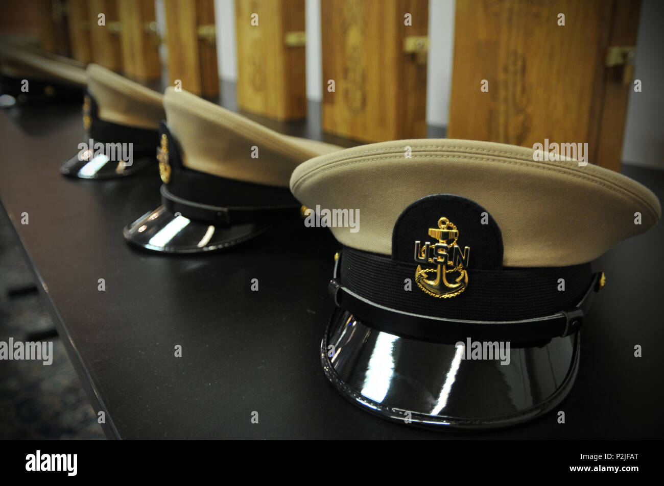 Nine Sailors from different commands put on khaki uniforms and