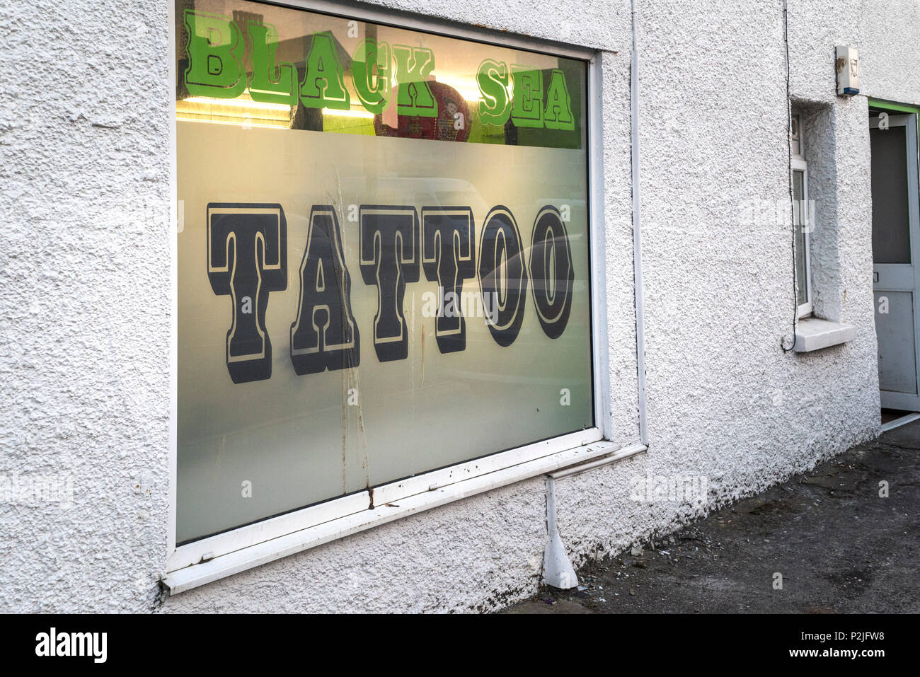 The window of a Tattoo studio Stock Photo - Alamy