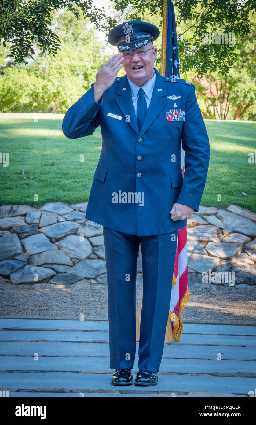 U.S. Air Force Lt. Col. Michael E. Mac Lain salutes family and friends after his promotion ceremony at the Scroll of Honor in Clemson University’s Memorial Park, Sept. 30, 2016. Mac Lain is the Aeromedical Operations Flight Commander for the 43rd  Aeromedical Evacuation Squadron, Pope Army Airfield, Fort Bragg, NC. He directs daily flight operations for 60 assigned personnel, and provides medical care as a Flight Nurse on aeromedical evacuation missions. Mac Lain has deployed nine times to combat zones and successfully aero medically evacuated over 700 of the most ill and severely injured Amer Stock Photo