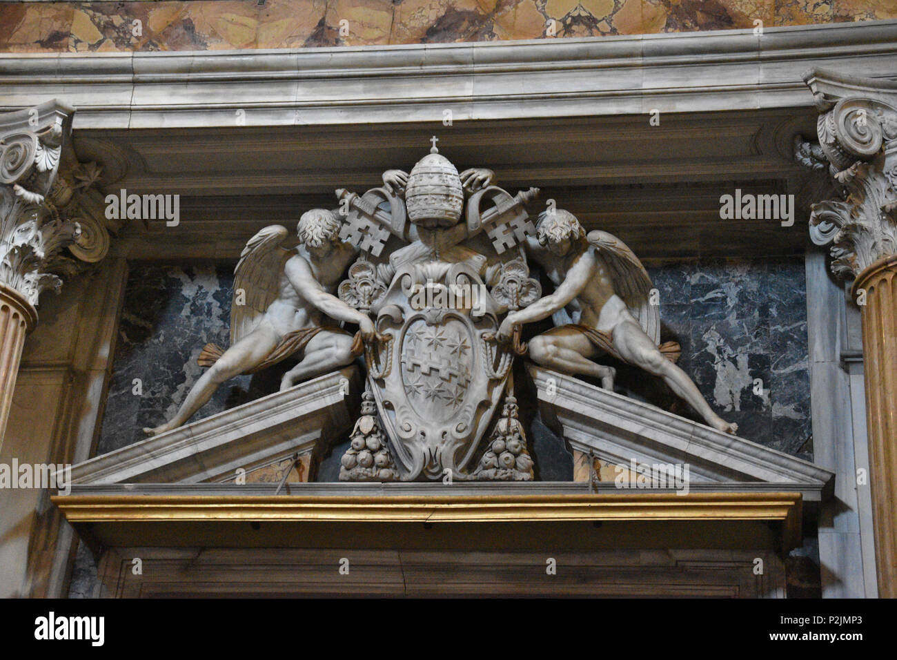 Angels holding the Coat of Arms of Pope Clement VIII (r 1592-1605). Archbasilica of St. John Lateran, St. John Lateran or the Lateran Basilica is the  Stock Photo