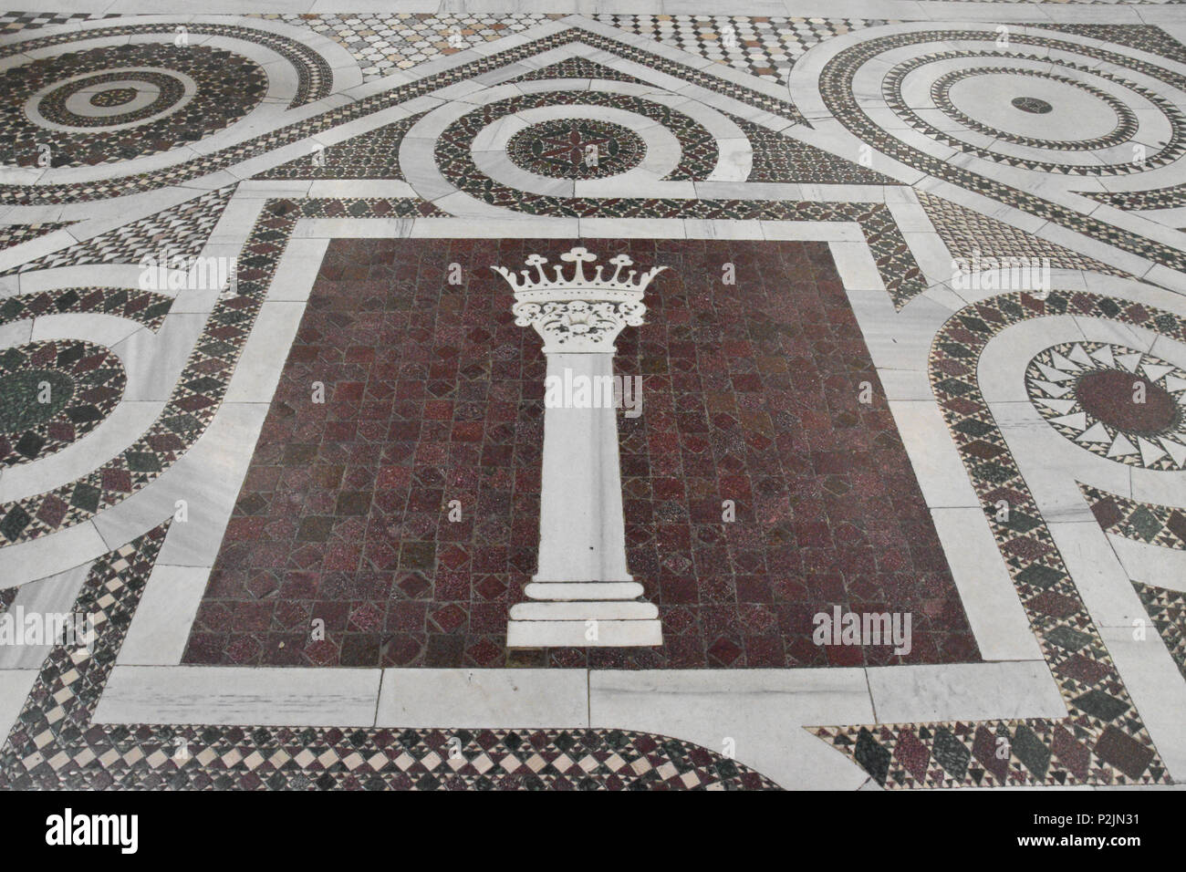 Heraldic symbol of Pope Martin V in the tiled mosaic floor of the