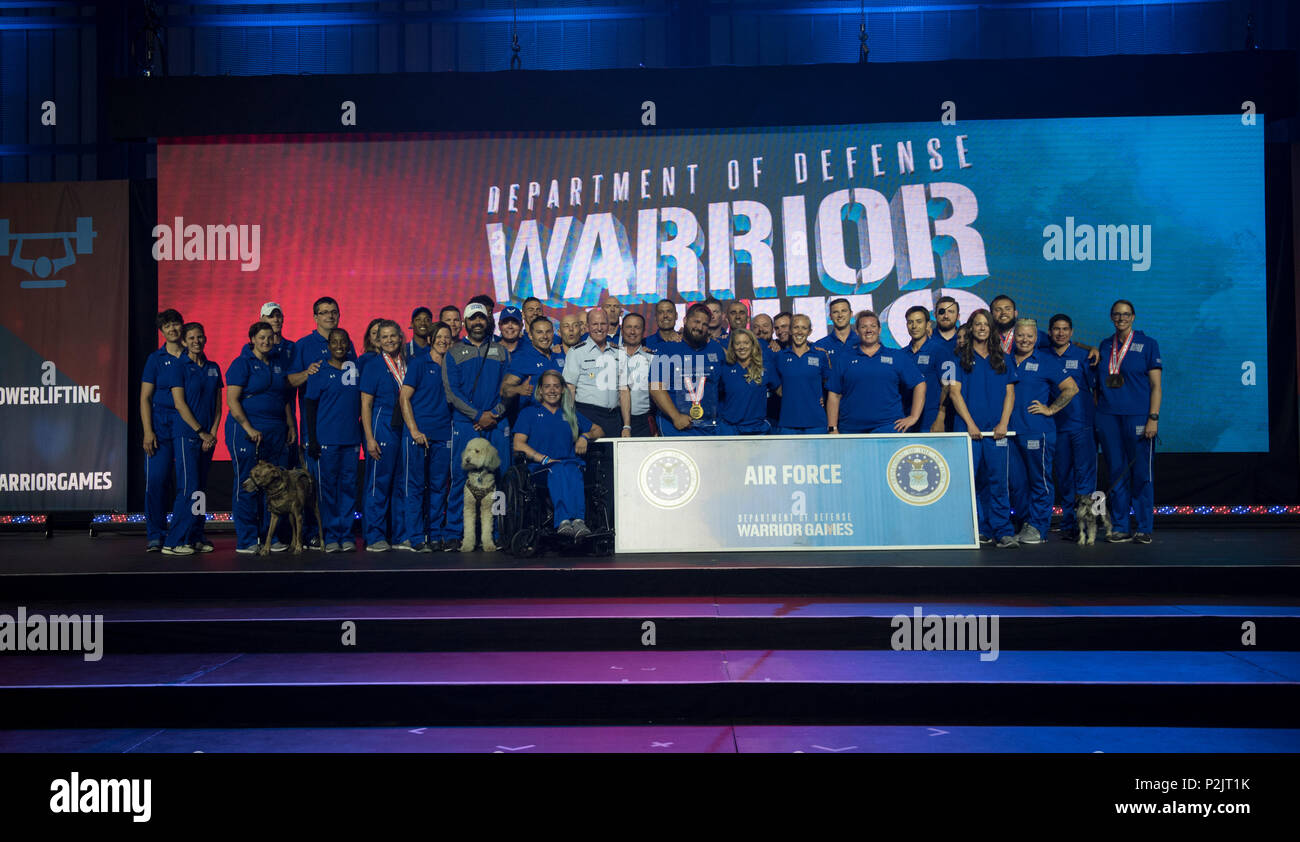 Team Air Force celebrates on stage at the closing ceremony of the Department of Defense Warrior Games in Colorado Springs, Colorado, June 9, 2018. The Games will be held in Tampa, Florida, at the Special Operations Command headquarters, in 2019. (U.S. Air Force Photo by Senior Airman Dennis Hoffman) Stock Photo