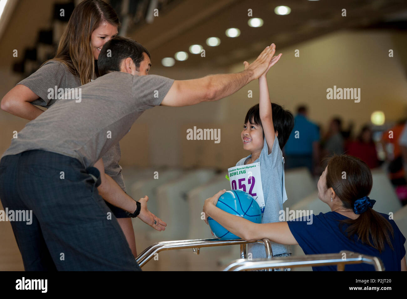 U S Air Force Capt Ryan Witzig Event Volunteer Assigned To Kadena Air Base Japan High Fives Misono Sports Participant During The 12th Annual Kadena Special Olympics Bowling Competition Oct 1 16 At Enagic