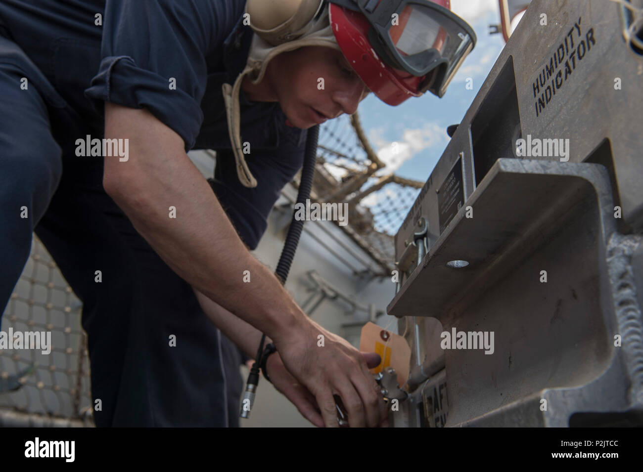 160903-N-KR961-066 PACIFIC OCEAN (Sept. 03, 2016) Aviation Ordnanceman 1st Class Ryan Heeney secures a RIM-116 Rolling Airframe Missile ammunition container aboard amphibious assault ship USS Boxer (LHD 4). Boxer, flagship for the Boxer Amphibious Ready Group, 13th Marine Expeditionary Unit team, is operating in the U.S. 3rd Fleet area of operations. (U. S. Navy photo by Mass Communication Specialist 2nd Class Debra Daco/Released) Stock Photo