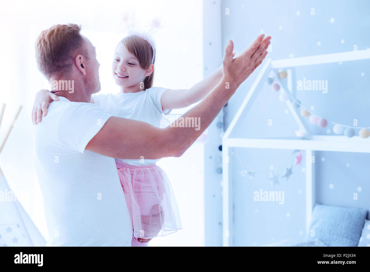 Adorable little girl dancing with mindful father Stock Photo Alamy