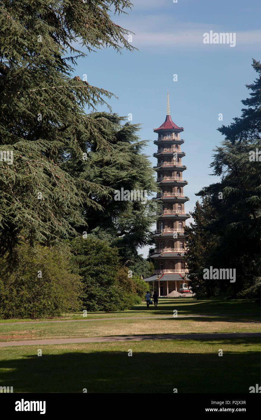 View of the Great Pagoda at Kew Gardens in London, United Kingdom. The Royal Botanic Gardens, Kew, usually referred to simply as Kew Gardens, are 121 hectares of botanical gardens and glasshouses between Richmond and Kew in southwest London. It is an internationally important botanical research and education institution with 700 staff, receiving around 2 million visitors per year. Its living collections include more than 30,000 different kinds of plants. Stock Photo