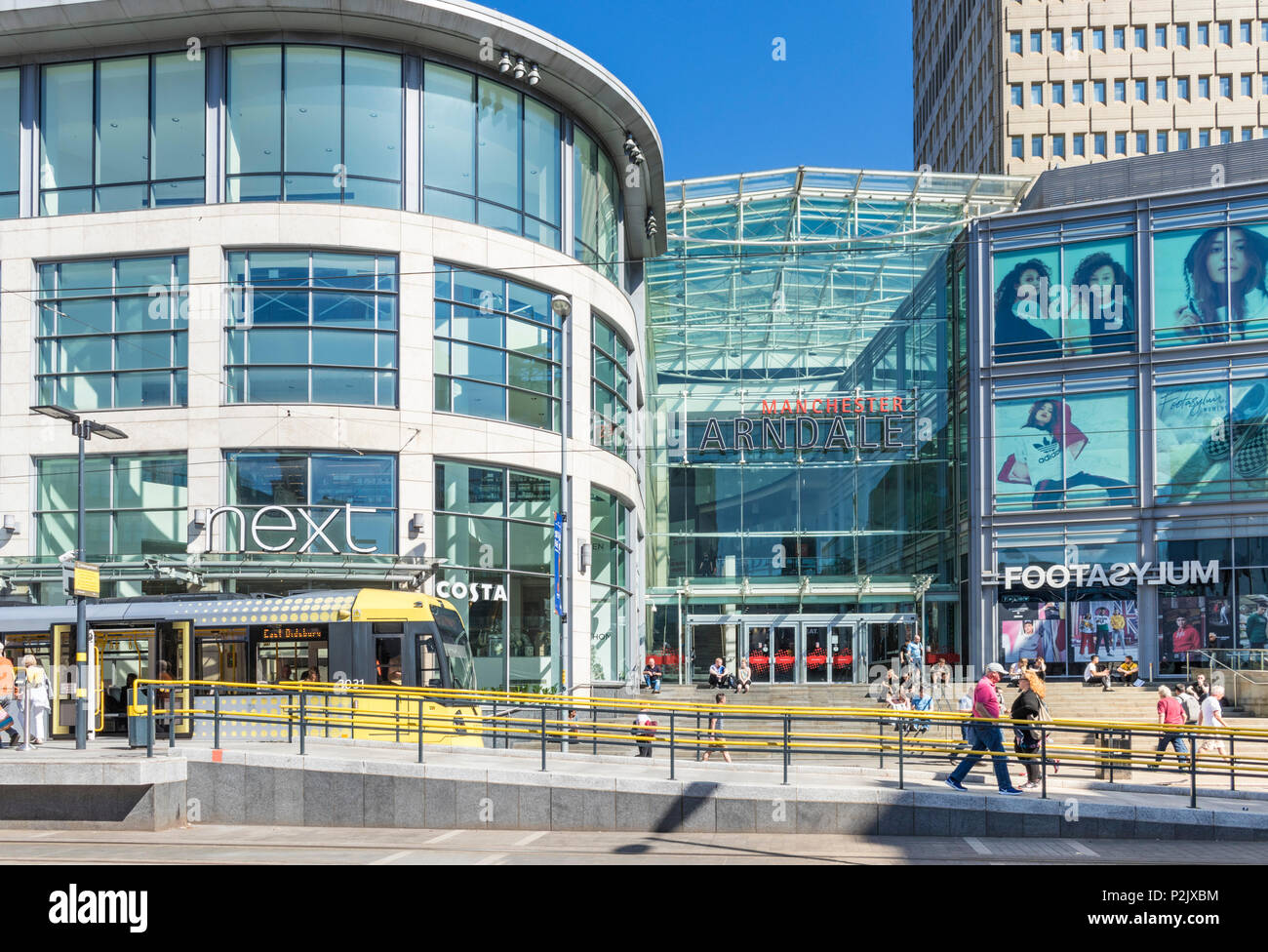 England Manchester England Manchester City centre city center shoppers outside Next store exchange square manchester Arndale centre Manchester uk Stock Photo