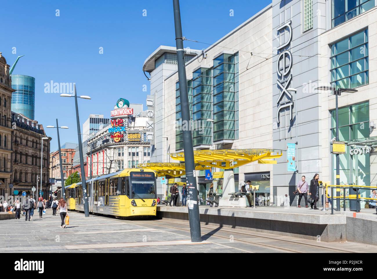 England Manchester England Manchester tram stop exchange square City centre city center Next store  manchester Arndale centre Manchester uk Stock Photo