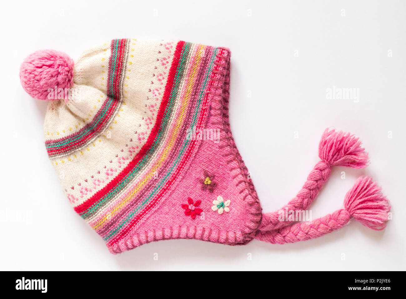 girls pink hat with pompom and tassels isolated on white background Stock Photo