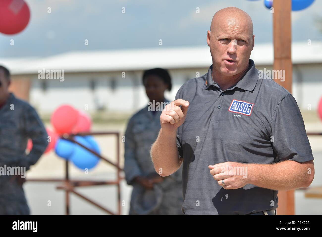 Grant McCormick, Rhein Main Area director, speaks to personnel attending the USO Incirlik grand opening ceremony Sept. 23, 2016, at Incirlik Air Base, Turkey. USO Incirlik provides U.S. and coalition forces a place to come together and relax during their off time. (U.S. Air Force photo by Senior Airman John Nieves Camacho) Stock Photo