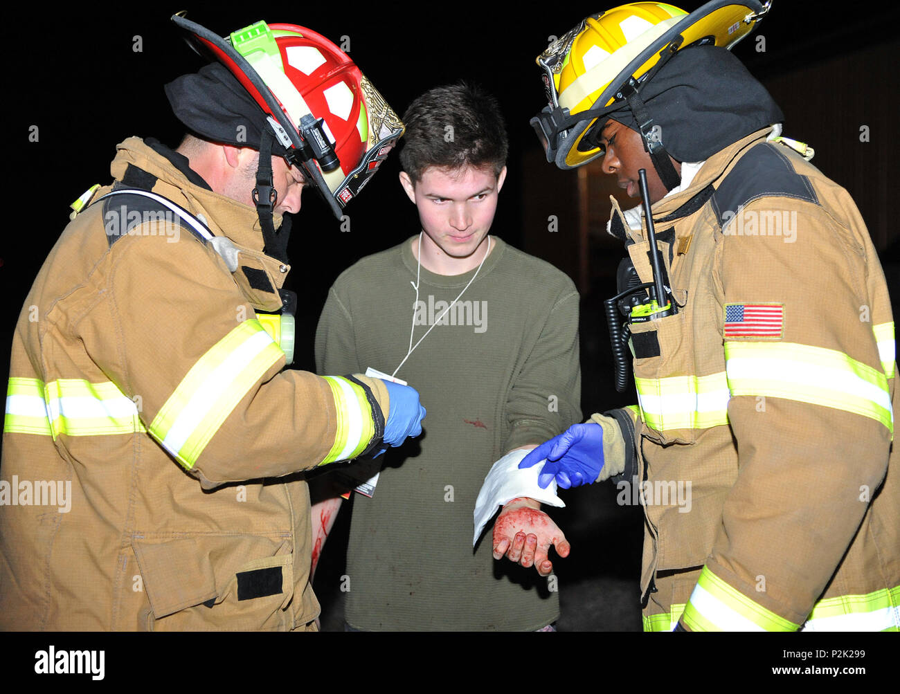 Grand Forks AFB firefighters practice first aid procedures on a