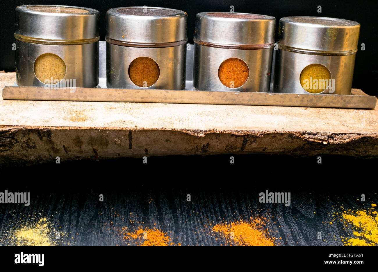 Colorful herbs and spices in metal and glass jars. Natural colors and top view. Health India