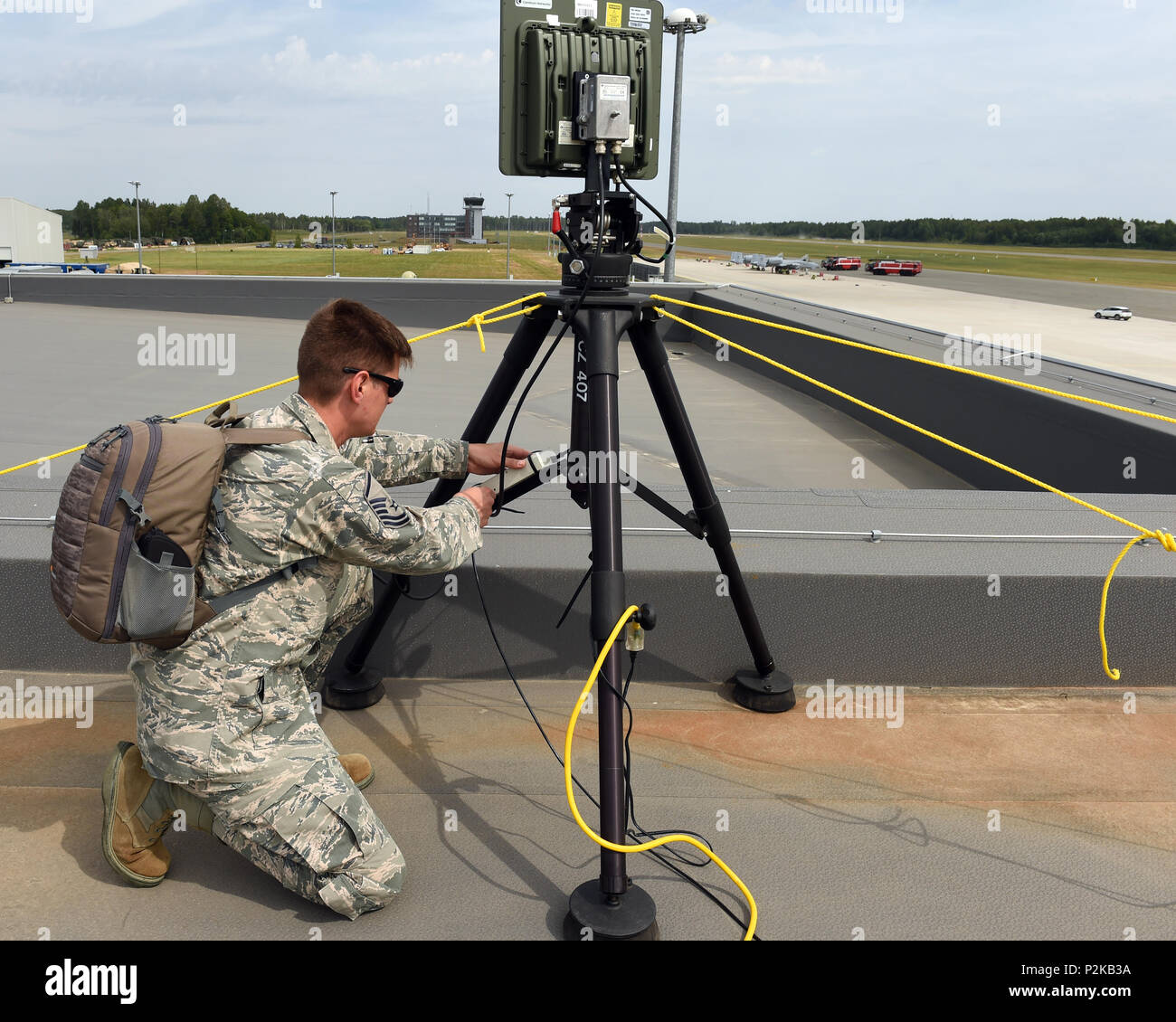 LIELVARDE AIR BASE, Latvia-- Master Sgt. Steven Haven aims a radio  frequency kit (RFK), mounted on top of the Operations Building, at another  RFK. The RFK allows for long distance network links,