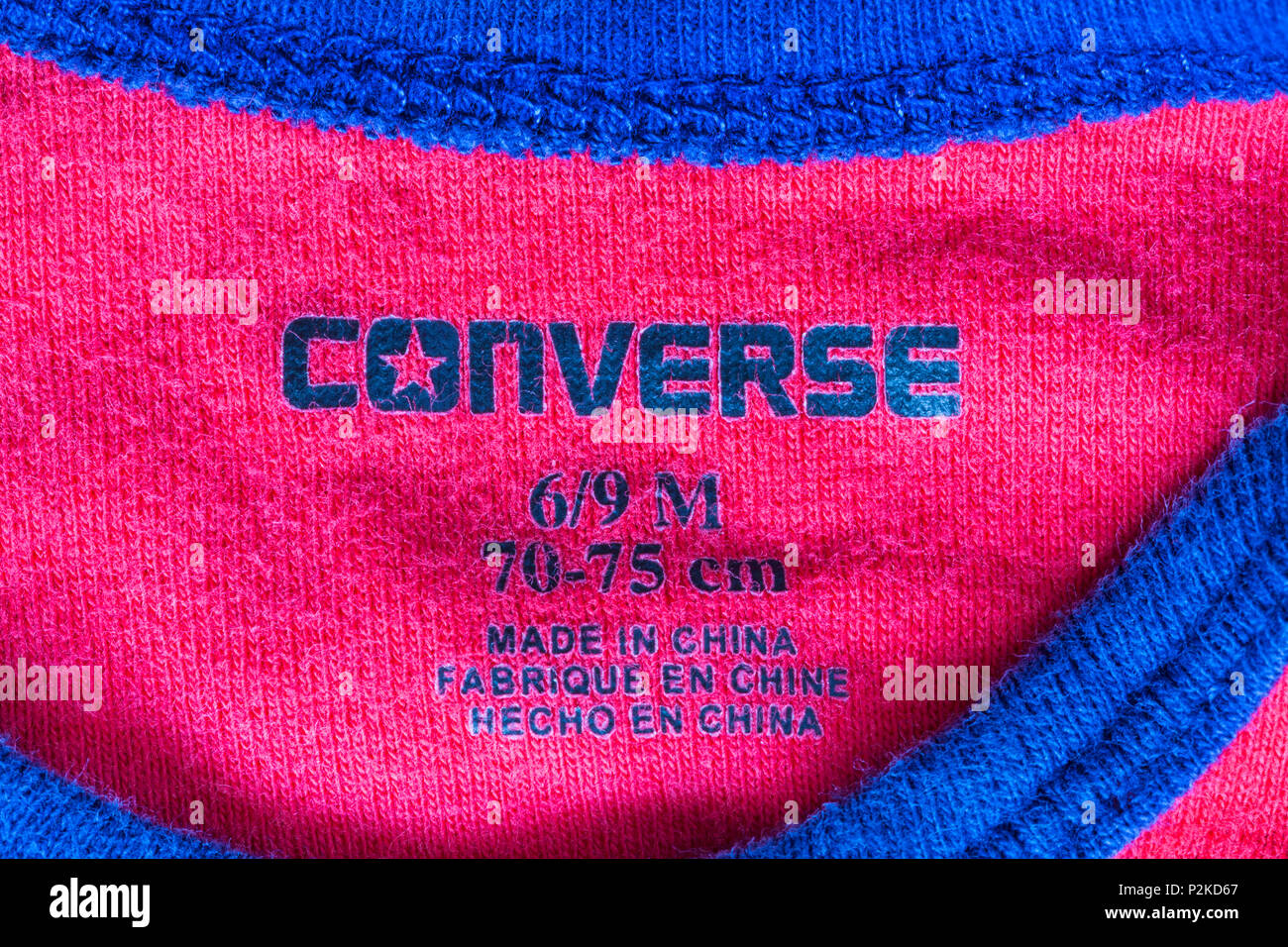 Converse stamp in baby's clothing made in China Stock Photo - Alamy