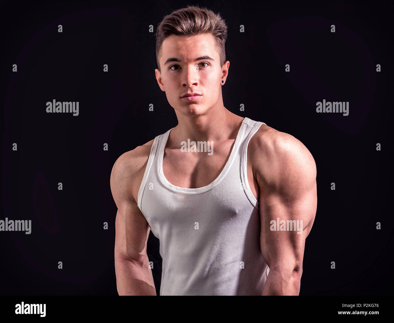 Handsome young muscular man in studio shot Stock Photo - Alamy