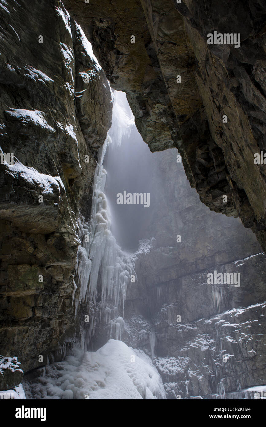View from Breitachklamm to steep rock walls in Winter with snowfall and icicles, Obersdorf, Germany 2014 Stock Photo