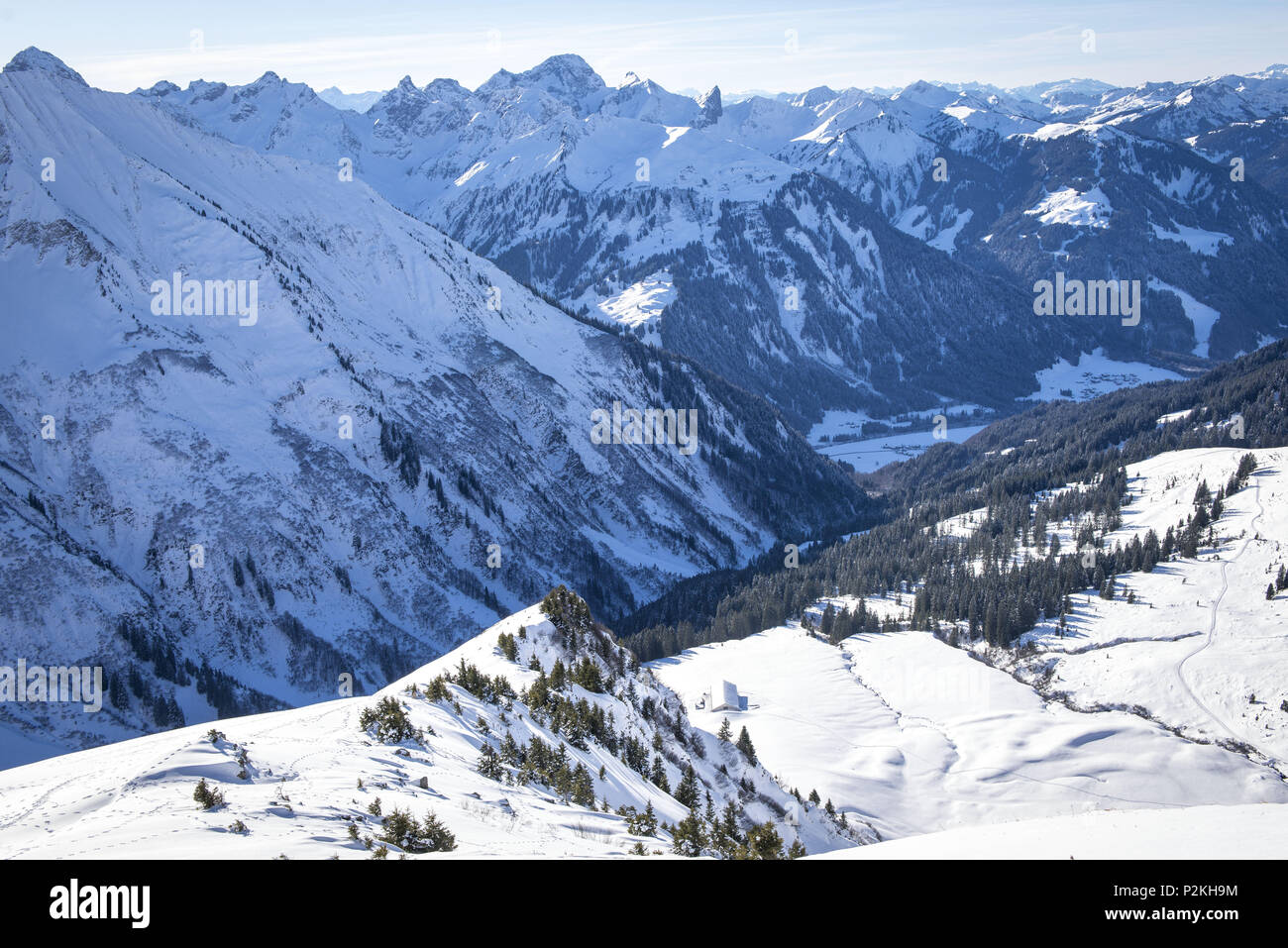 View to the Schwarzwasser valley in winter, sunny and snowy winter landscape, Vorarlberg, Austria Stock Photo