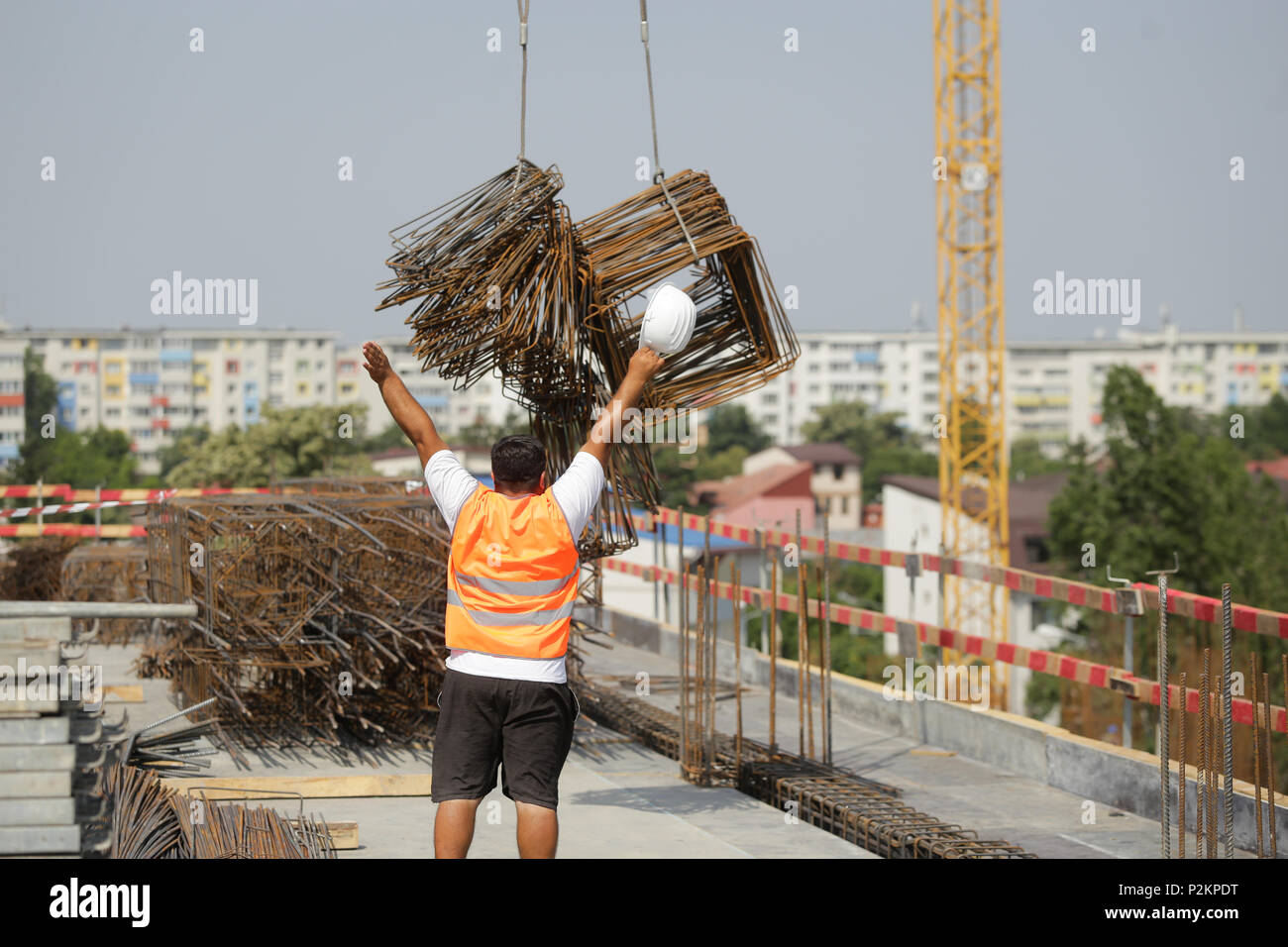 BUCHAREST, ROMANIA - JUNE 14, 2018: Workers on a construction site Stock Photo