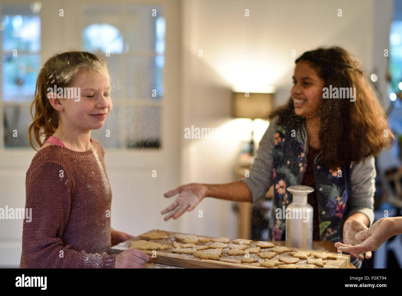 11 years old girls baking christmas cookies, Hamburg, Germany Stock Photo