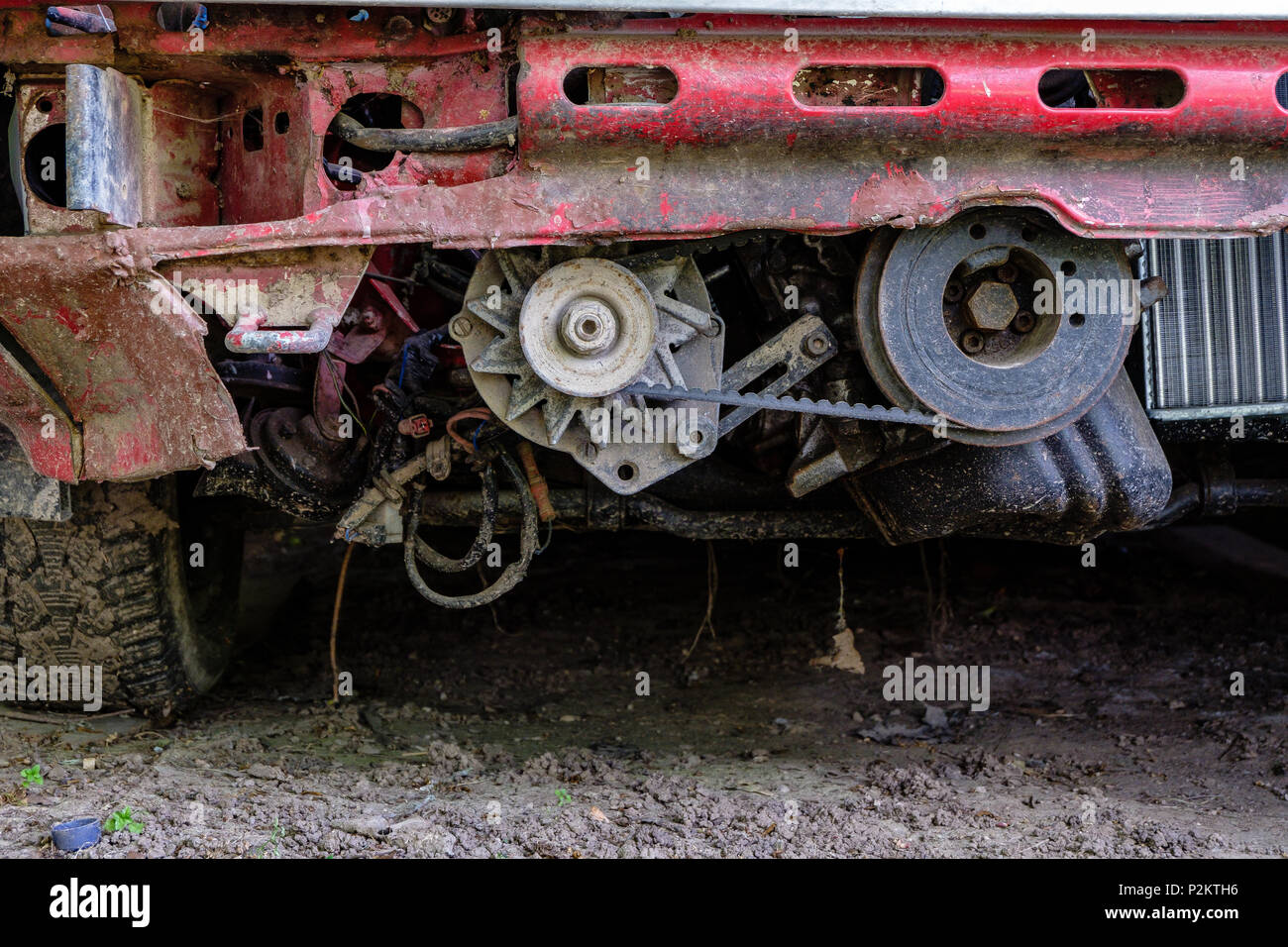 Detail of red tractor in countryside. engine parts and tires Stock ...