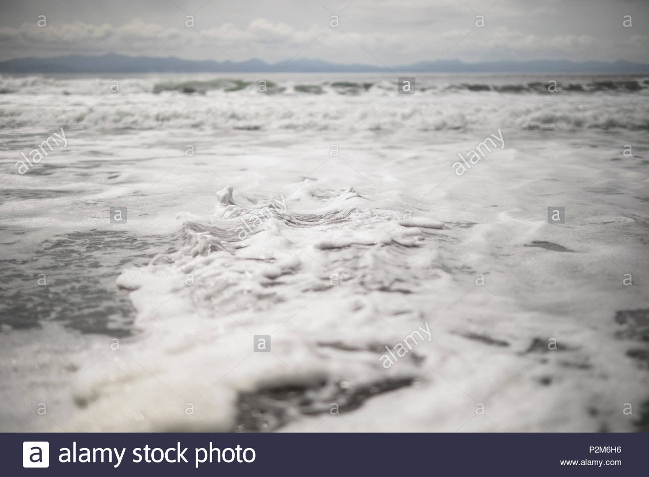 Foamy, rugged ocean surf Stock Photo Alamy